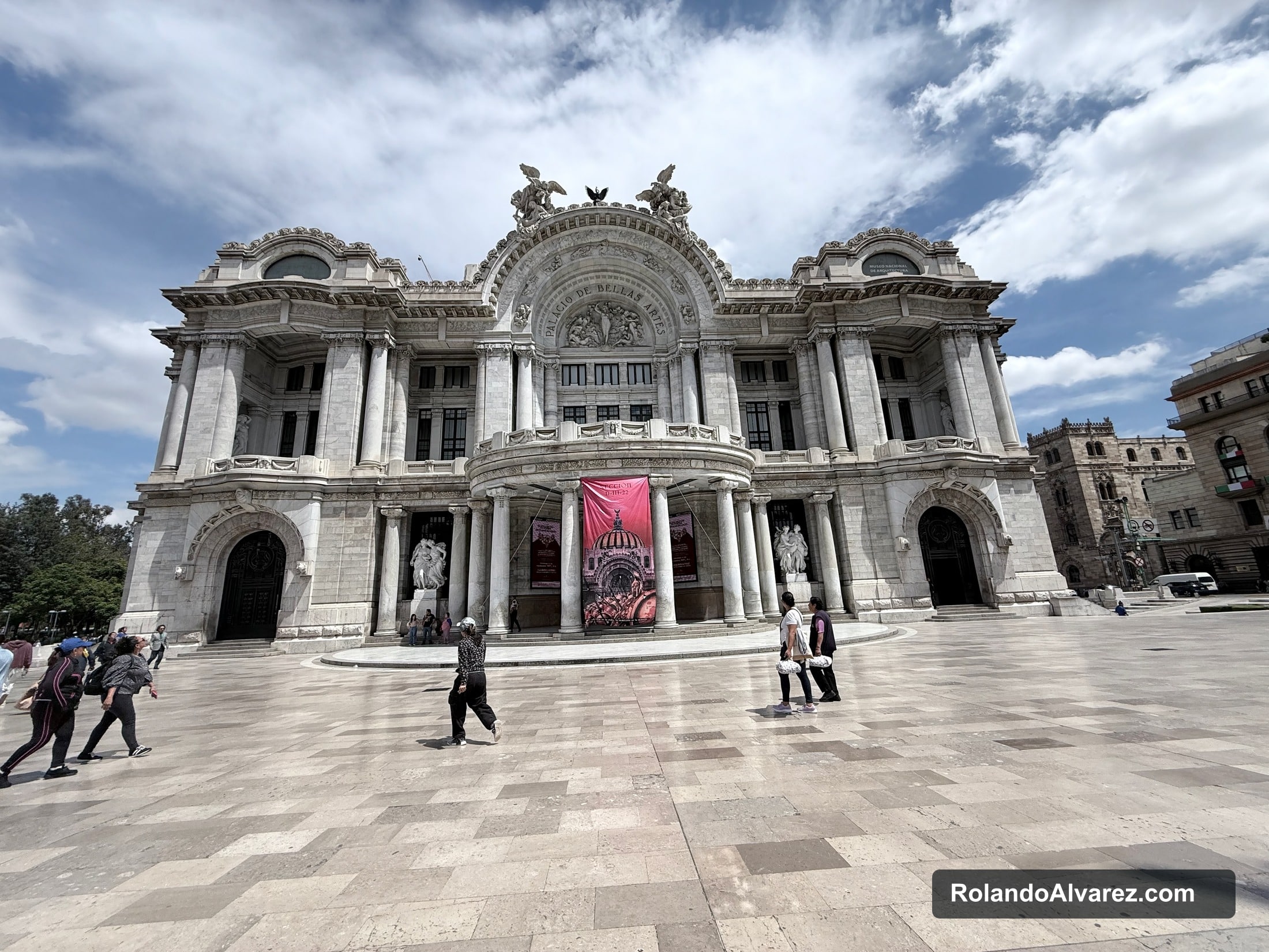 The ornate Palacio de Bellas Artes beneath a dramatic sky