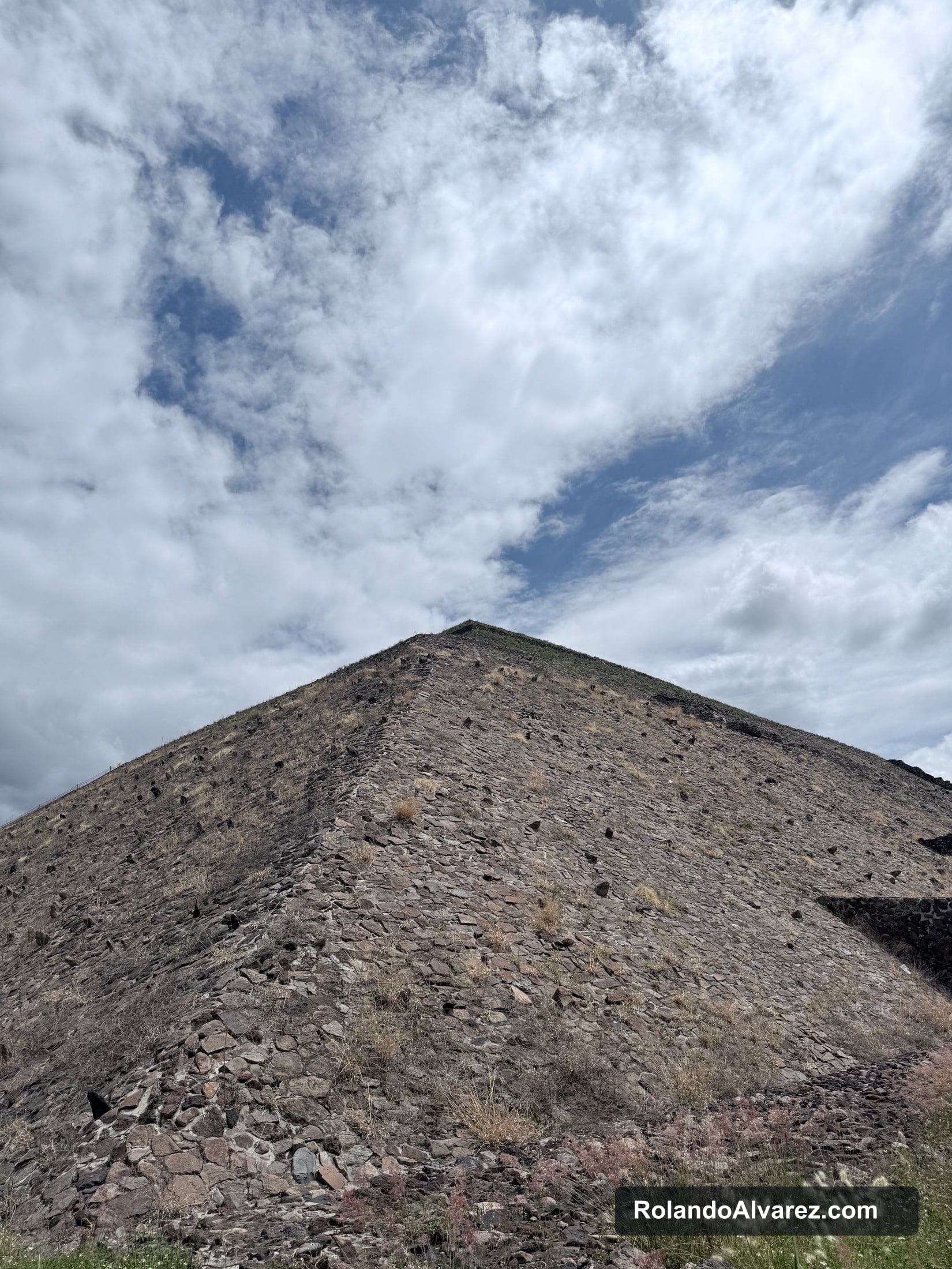The Pyramid of the Sun rising beneath textured clouds at Teotihuacán