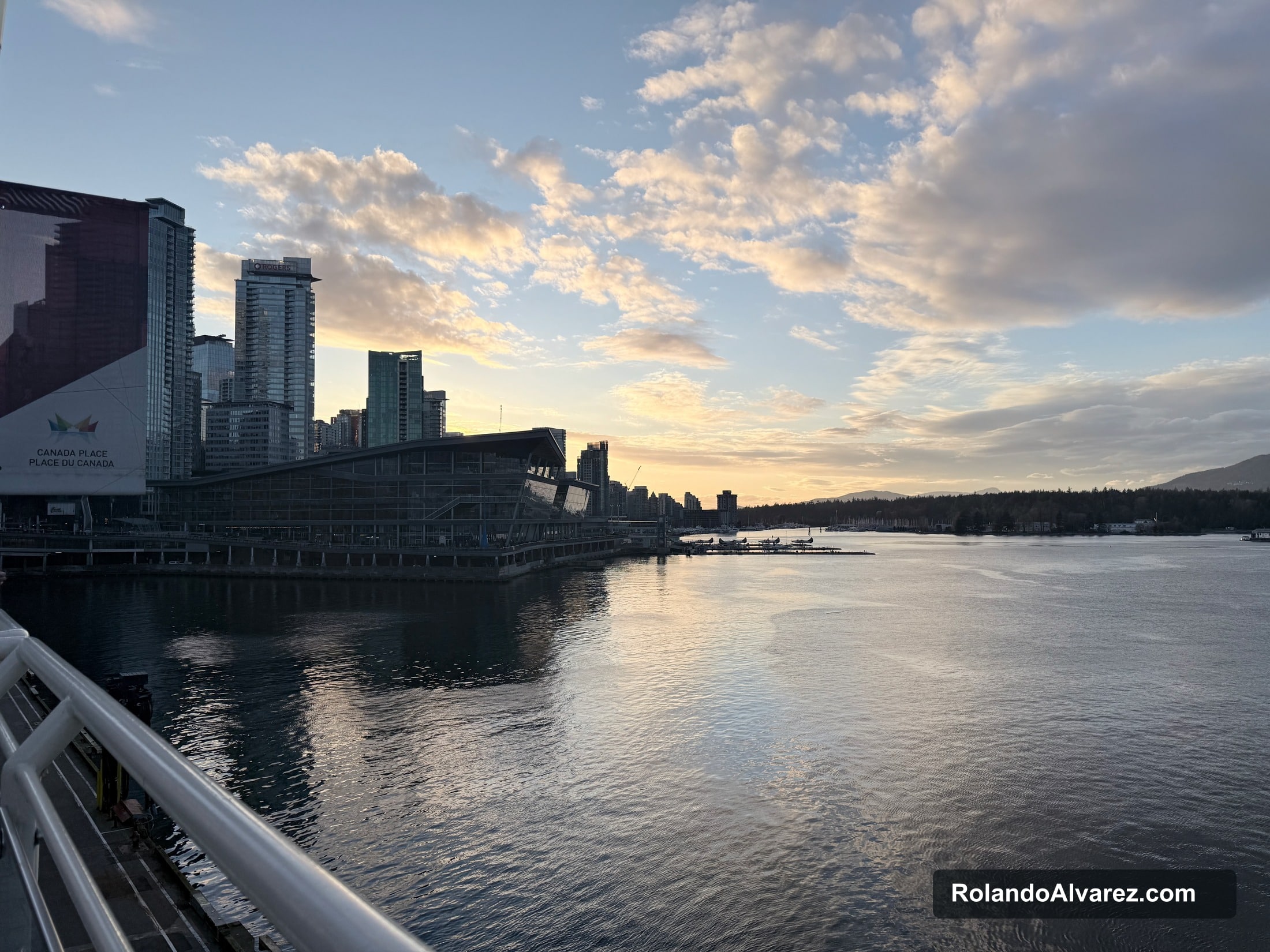 Canada Place and Vancouver harbour beneath a glowing evening sky